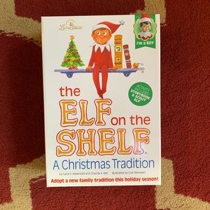 Elf on the shelf with boy doll